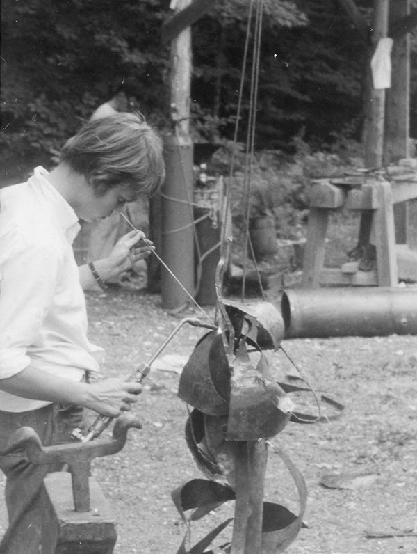 Man working on a metals culpture